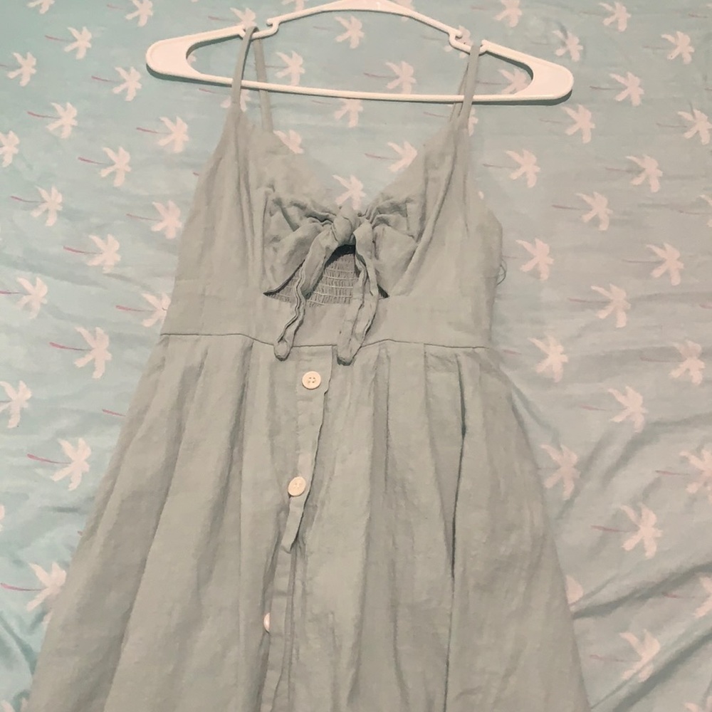 cute green dress with bow in the middle